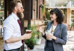 Two people chatting while having a drink