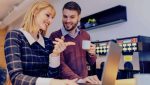 Man and woman looking at laptop screen